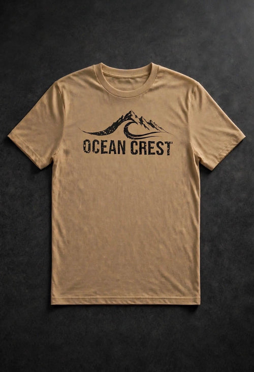 Tan crewneck t-shirt with black mountain-and-wave OCEAN CREST graphic.