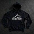 Black pullover hoodie with white distressed OCEAN CREST graphic.